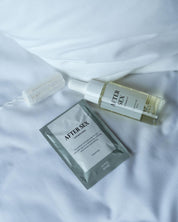 Aima Sense After Sex kit med intimservett, olja och tampong på vit bädd